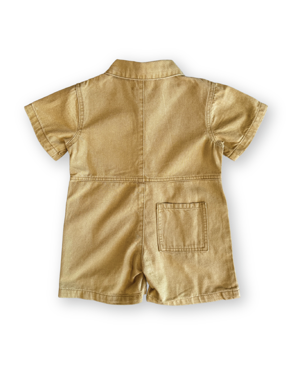 Beige romper on a white background